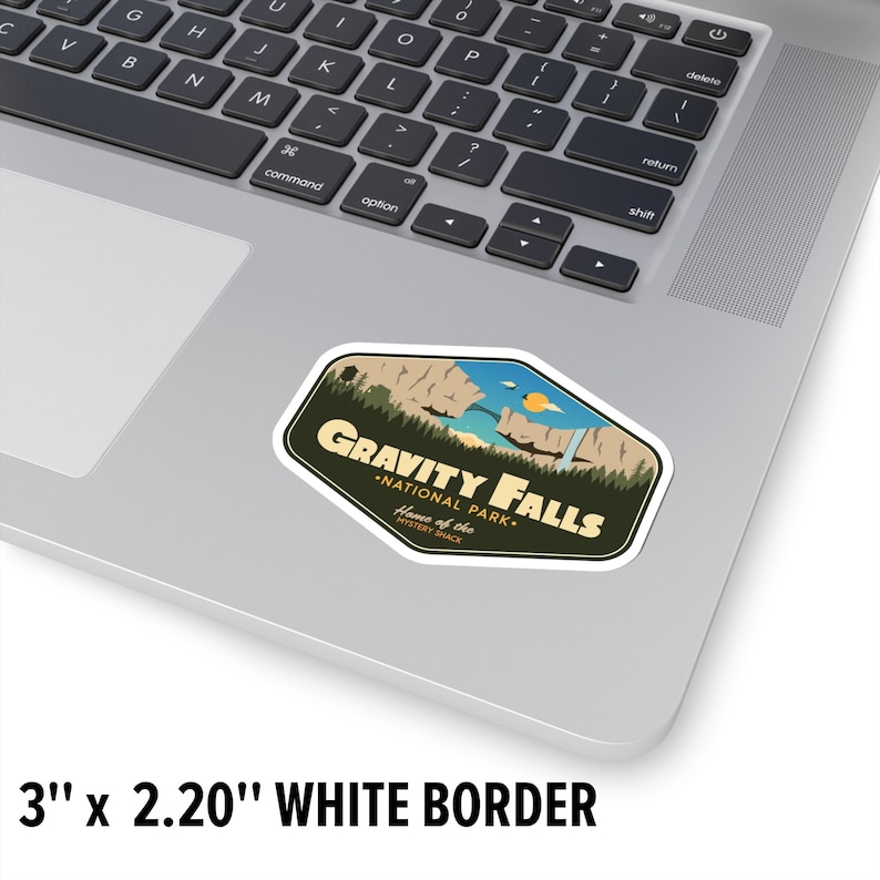 May include: A sticker featuring a retro-style design for Gravity Falls National Park, a fictional park from the animated series Gravity Falls. The sticker features a scenic view of a waterfall and mountains, with the text "Gravity Falls National Park" and "Home of the Mystery Shack" in a vintage font.