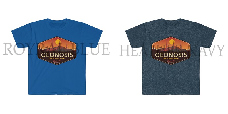 May include: Two t-shirts featuring a graphic design of a sunset landscape with the text "Geonosis National Park" in a vintage style. The t-shirt on the left is royal blue and the t-shirt on the right is heather navy.