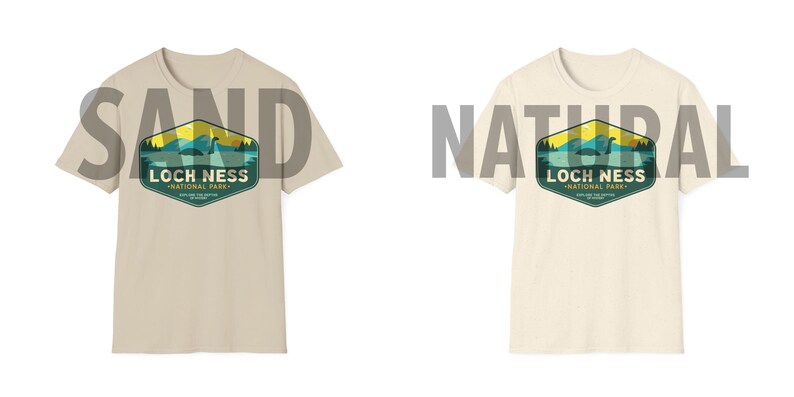 May include: Two t-shirts with a vintage-style graphic of the Loch Ness National Park. The graphic features a green and blue landscape with a yellow sun and a silhouette of the Loch Ness Monster. The t-shirts are available in sand and natural colors.