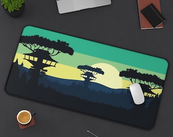May include: A green, yellow, and blue mouse pad with a silhouette of a treehouse and a sunset. The mouse pad is on a black surface with a coffee cup, pencils, and a computer mouse.