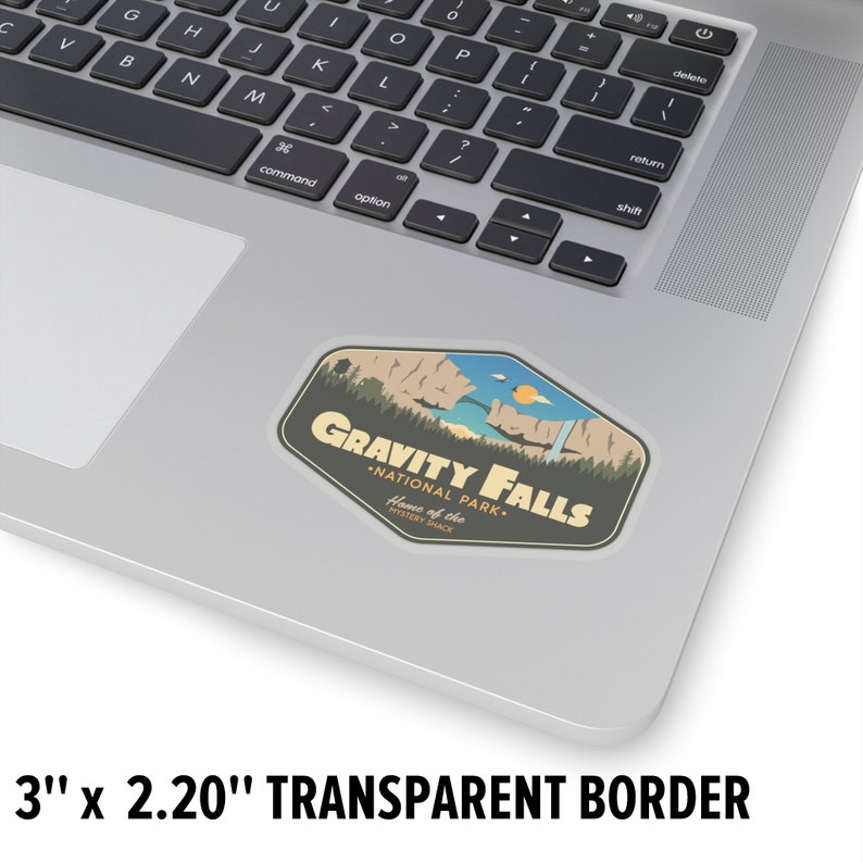May include: A sticker featuring a retro-style illustration of a mountain range, a lake, and a waterfall. The text reads "Gravity Falls - National Park - Home of the Mystery Shack". The sticker is 3 inches by 2.20 inches and has a transparent border.