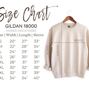 May include: A beige Gildan 18000 unisex sweatshirt hangs on a wooden hanger. The image includes a size chart with measurements in inches for width, length, and sleeve length, ranging from size S to 5XL.