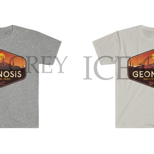 May include: Two t-shirts featuring a graphic design of a sunset over a mountain range with the text "Geonosis National Park" in a hexagon shape. The t-shirts are in grey and white.