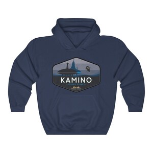 May include: Navy blue hooded sweatshirt with a graphic of a city on a planet with the text "KAMINO - STORMY PLANET - Visit the ENDLESS OCEAN".