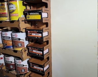 May include: A wooden wall-mounted organizer with five shelves, each holding a box of screws. The boxes are labeled "Modified Truss Screws" and "Drywall Screws".