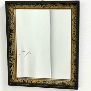 Rectangular mirror from the 1930s in black and gold ebonized wood