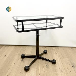 Coffee or living room table, made of glass and black painted metal with wheels, vintage space age, Allegri Arredamenti, 70s