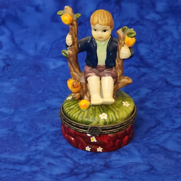 Porcelain Hummel Like Hinged Trinket or Jewelry Box Boy Sitting on Fruit Tree with Birds