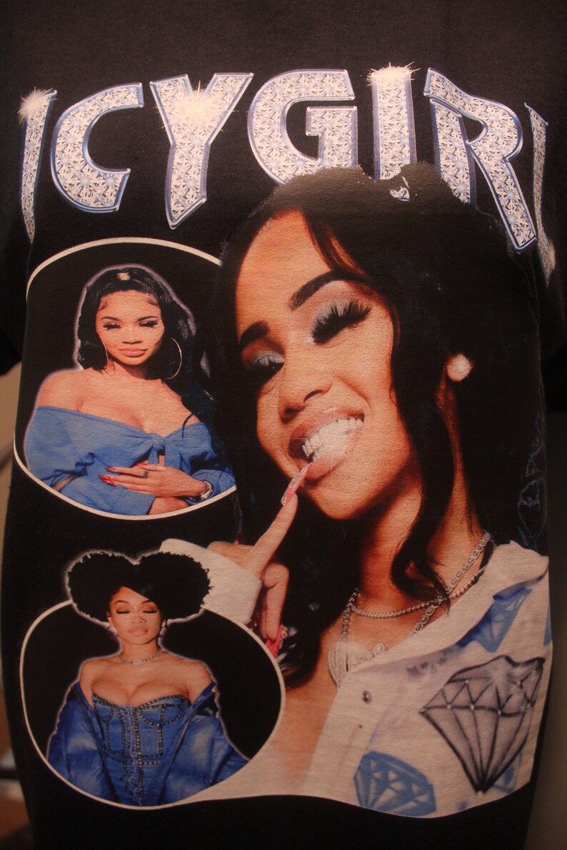 May include: Black t-shirt with a white diamond-encrusted "ICY GIRL" graphic. The shirt features three images of women wearing denim jackets and blue clothing.