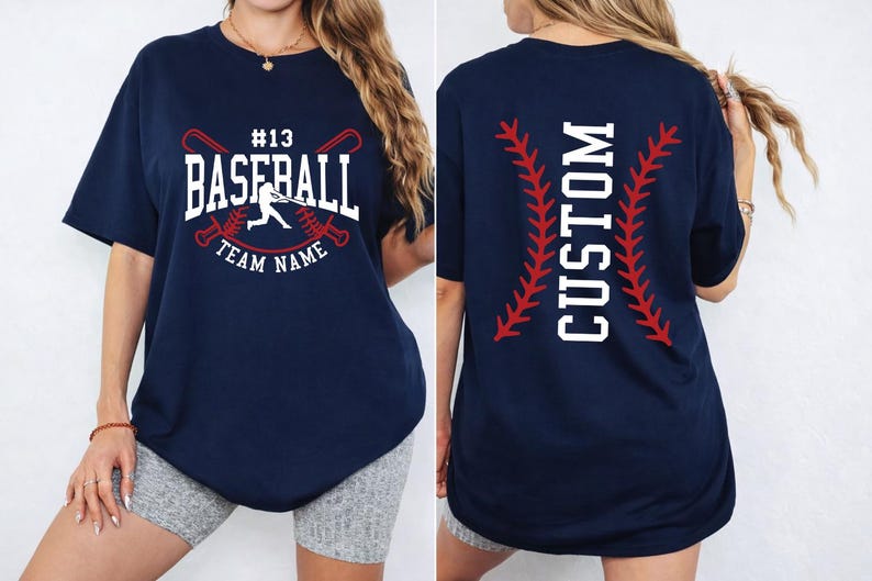 A woman wearing a navy blue t-shirt with a baseball design and the text "CUSTOM" printed on the back.