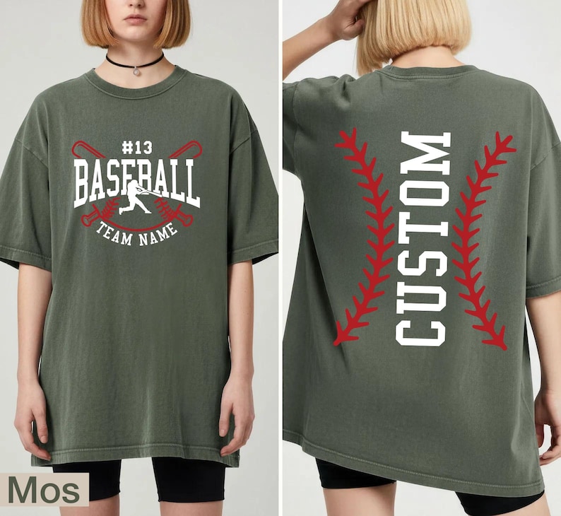 A woman wearing a green t-shirt with a baseball design and text printed on it.
