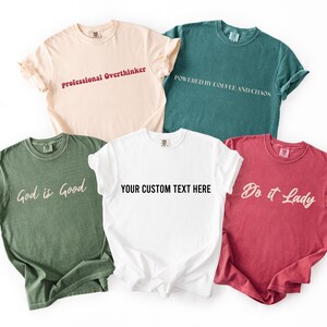 a collection of six t-shirts, each with a unique design and message printed on them.