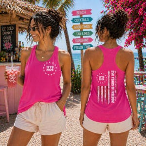 A woman wearing a pink tank top with the text "1776" and "50 YEARS OF FREEDOM" printed on it, standing in front of a beach sign.