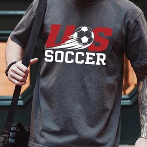 A person wearing a gray t-shirt with the text "LESS THAN 500" printed on it.