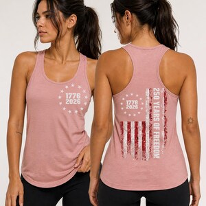 a woman wearing a pink tank top with a design on the back.