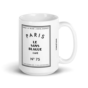 May include: White ceramic mug with a black graphic design featuring the text "ENNUI-SUR BLASE I HOVEL DISTRICT PARIS LE SANS BLAGUE CAFE N° 75 IT WAS ANOTHER TIME, IT WAS ANOTHER ENNUI" and "WES&BILL".