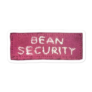 May include: A pink fabric patch with white text that reads "BEAN SECURITY".