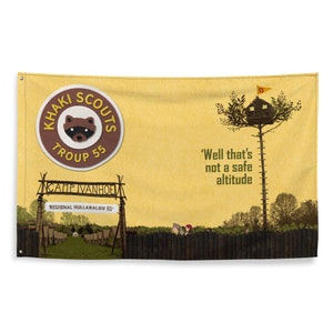 May include: A yellow flag with a brown circle that says "Khaki Scouts Troup 55" with a raccoon inside. The flag also has a wooden sign that says "Camp Ivanhoe Regional Hullabaloo 65" and a treehouse in a tree with the text "Well that's not a safe altitude".