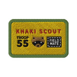 May include: Khaki Scout troop patch with the number 55, a raccoon mascot, and the words "Field Mate" in a box.