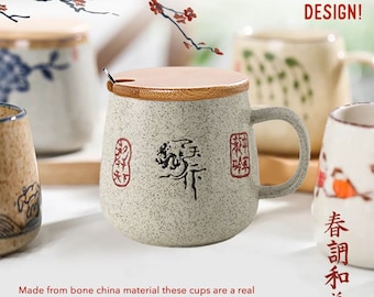 May include: A ceramic mug with a speckled gray finish, a bamboo lid, and a small spoon. The mug features Asian-inspired calligraphy and red stamps. The text "BEAUTIFULLY HANDMADE DESIGN!" is visible.