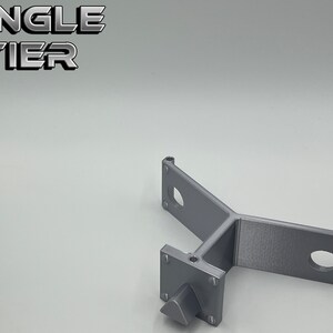 May include: A single tier gray metal shelf bracket with three mounting holes and a single screw. The text "SINGLE TIER" is visible in the background.