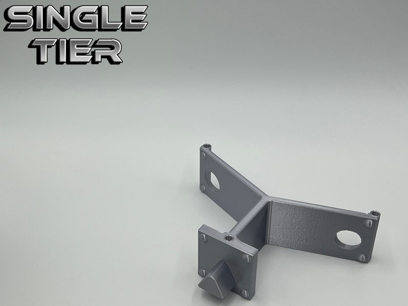 May include: A single tier gray metal shelf bracket with three mounting holes and a single screw. The text "SINGLE TIER" is visible in the background.