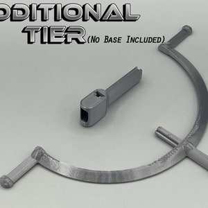 May include: Two gray 3D printed pieces for a tiered stand. The larger piece is a curved, three-pronged base. The smaller piece is a straight connector.  ADDITIONAL TIER (NO BASE INCLUDED) is printed on the image.