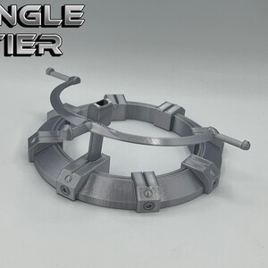 May include: A single-tier, silver-colored, 3D printed display stand with a circular base and a curved arm. The text "SINGLE TIER" is printed in black letters on a white background.