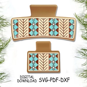 May include: Two brown hair clips with a geometric pattern of white, brown, and blue. The pattern is reminiscent of Native American art.