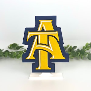 North Carolina A&T State University Aggies decoration with ivy behind it.