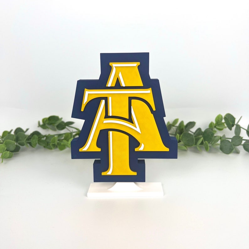 North Carolina A&T State University Aggies decoration with ivy behind it.