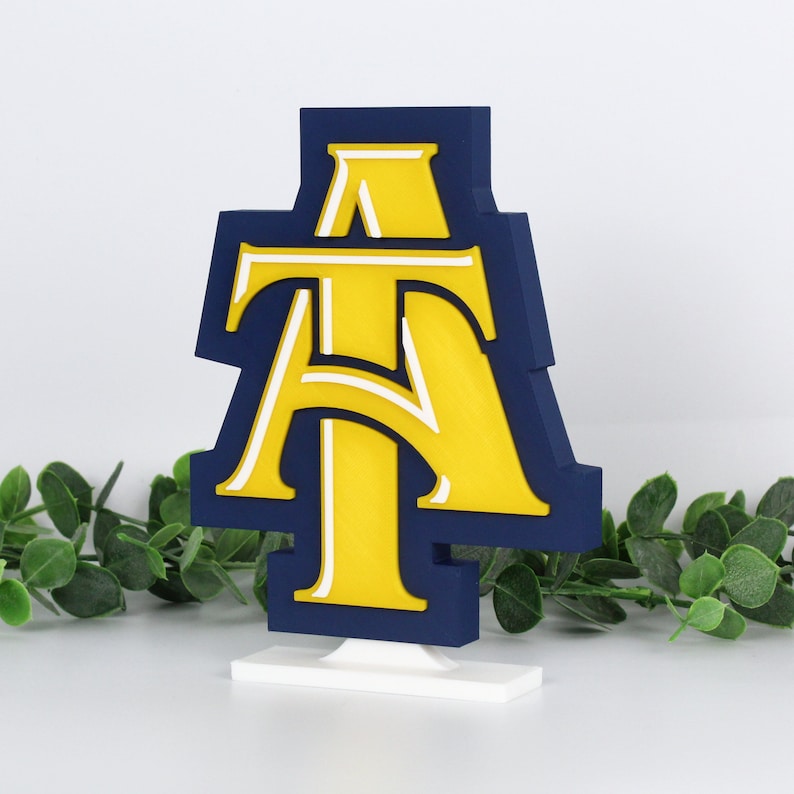 North Carolina A&T State University Aggies decoration with ivy behind it, left side.
