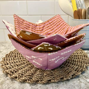 May include: A rustic wooden sign with the text "Welcome to our home" in white lettering. The sign features a distressed finish and a simple, inviting design, perfect for entryway decor.