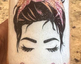 May include: A white tumbler with a pink and orange "Dunkin' Junkie" design. The tumbler features a cartoon woman with a bun and a bow, and the text "Junkie Junkie Life". The tumbler is decorated with sprinkles and doughnuts.