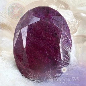 May include: A deep purple, oval-cut sapphire gemstone. The image shows a faceted stone, described as a "Treated Genuine Corundum Sapphire Specimen." The text "Water of the Stars" is also visible.