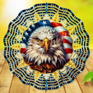 May include: A decorative metal wind spinner featuring a bald eagle and the American flag. The spinner has a layered, wavy design with blue, gold, and white accents. Ideal for garden or patio decoration, it measures approximately 30 cm in diameter.