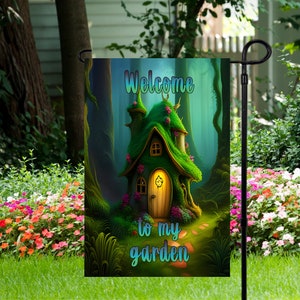May include: A green and brown garden flag featuring a whimsical illustration of a house in the woods. The text "Welcome to my garden" is written in a whimsical font.