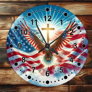 May include: Round wall clock featuring an American flag design with an eagle and a cross. The clock face has a blue background with white stars and red and white stripes. The clock hands are black.