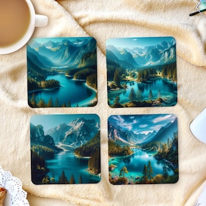 May include: Four square coasters displaying a scenic landscape with a turquoise lake, mountains, and trees. The coasters have a glossy finish and are arranged on a beige surface. A cup of coffee, pen, and snacks are also visible.