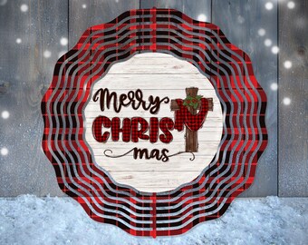May include: A red and black plaid wreath with the words "Merry Christmas" and a cross with a red and black plaid scarf on it.