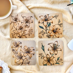 May include: Four square wooden coasters with a floral design. Each coaster features a different arrangement of lilies with brown and green accents.