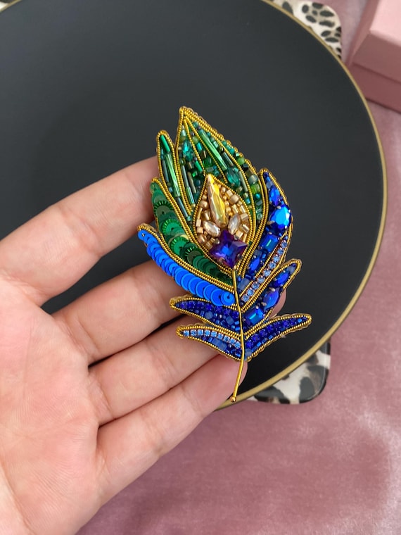 Peacock feather brooch deals