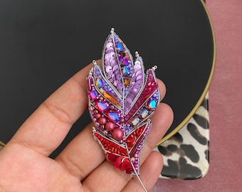 Handmade Beaded Feather Brooch: Colorful Crafted Pin