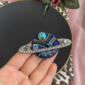 Chanel planet brooch online