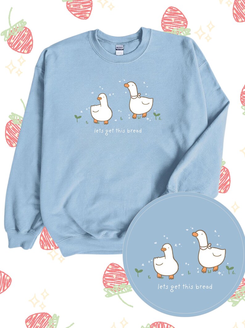 May include: Light blue sweatshirt with a graphic of two white geese and the text "lets get this bread".