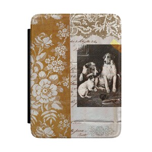 May include: A rectangular e-reader cover featuring a split design. The left side displays a white floral pattern on a mustard yellow background. The right side shows a black and white illustration of three dogs over a background of vintage script.