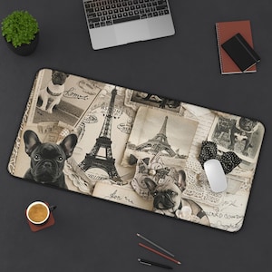May include: A rectangular desk mat featuring a vintage-style collage with sepia-toned images of the Eiffel Tower, French bulldog portraits, handwritten script, lace patterns, and black polka-dot bows. The design includes multiple dog illustrations.