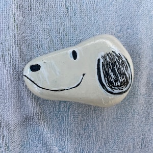 snoopy painted rock for garden