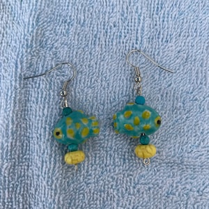 Blue and yellow glass fish earrings