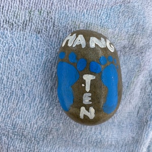Beach life inspired painted rock for garden